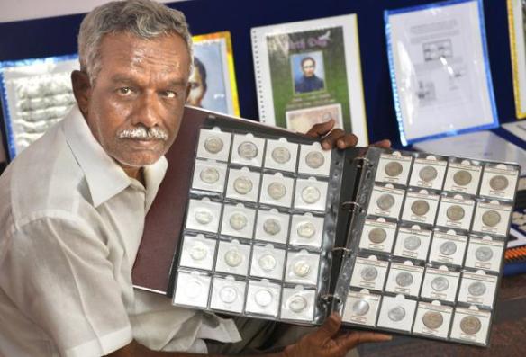Creating information and awareness: Perumalsamy and his collection of coins Photo: K. Ananthan THE HINDU